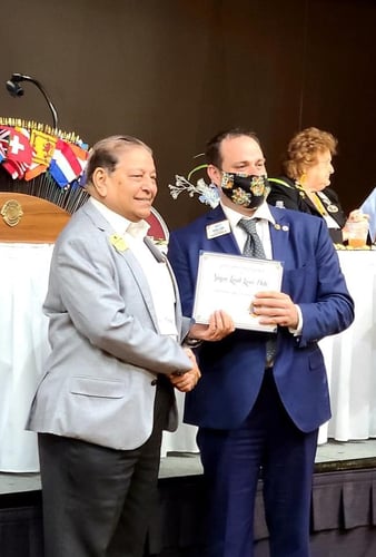 Lion M. Shafique Awan receiving his chevron award.