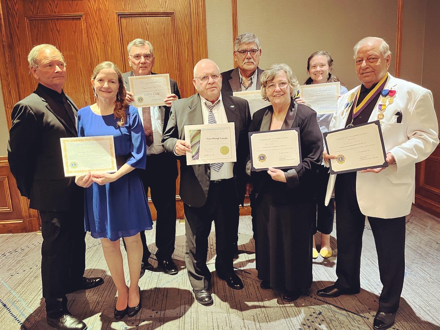 Sugar Land Lions stand in group holding their awards.